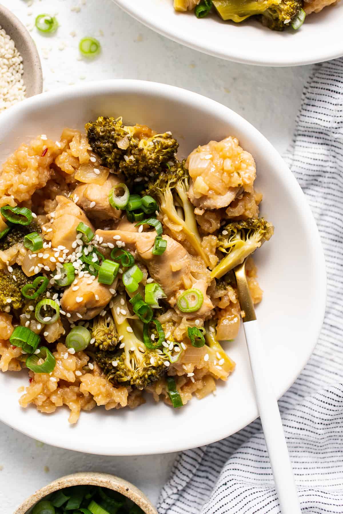 This Orange Chicken Casserole combines a classic takeout meal with easy at-home prep, made with just one dish! chicken casserole in bowl.