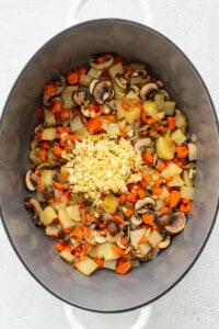 Vegetables and garlic in a Dutch oven.