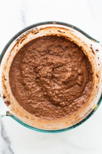 Chocolate batter in a glass bowl.