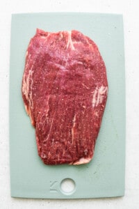 tenderized beef on cutting board.