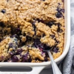 Blueberry muffin oatmeal bake in a casserole dish.