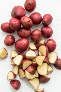 Sliced red potatoes on a white background.
