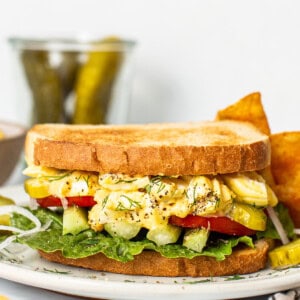 Egg salad sandwich on a plate.