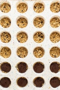 A tray filled with granola bars and chocolate chips.