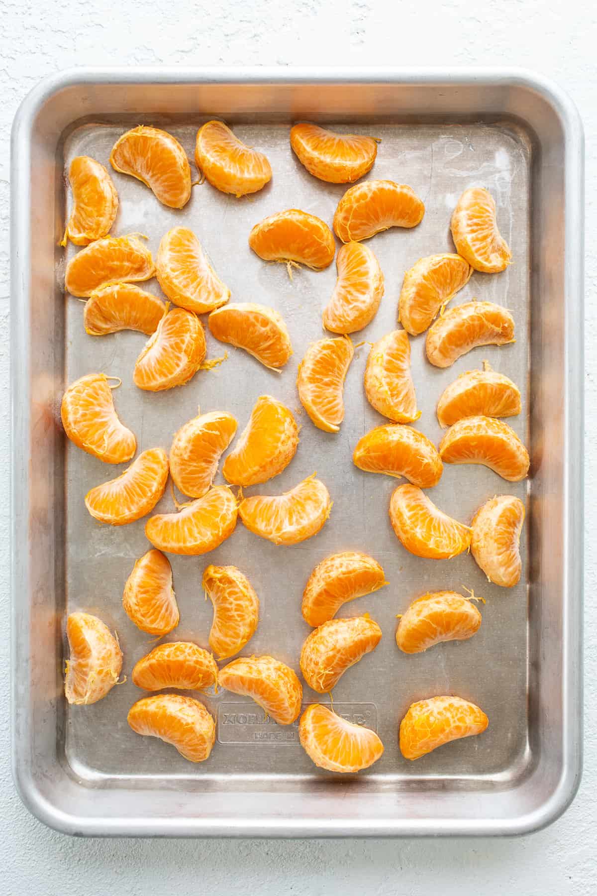 clementines on baking sheet.