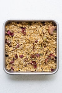 A metal pan with granola in it.
