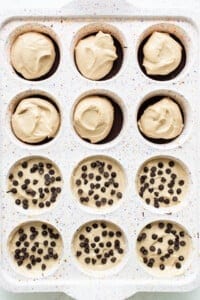 Chocolate chip cookie cups in a baking pan.