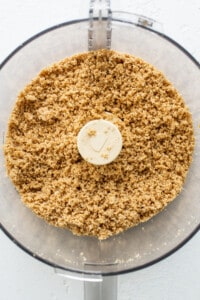 A food processor filled with granola.
