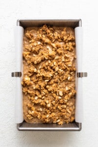 A baking pan filled with oats and granola.