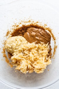 A bowl of ingredients for a peanut butter cookie.