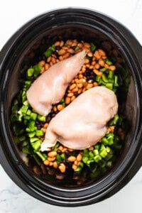 Chicken and beans in a slow cooker.