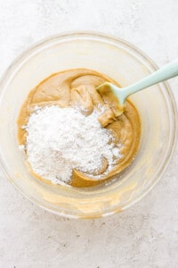 a bowl of peanut butter and powdered sugar.