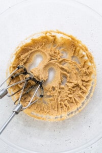 peanut butter in a bowl with a whisk.