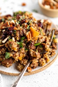 A plate with quinoa and nuts on it.