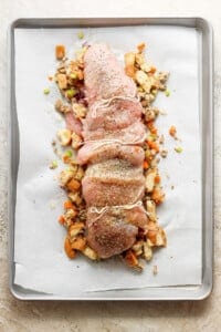 A baking sheet with a piece of meat on it.