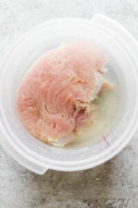 A bowl of chicken in a bowl of water.