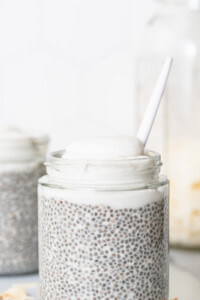 Chia pudding in a jar with a spoon.