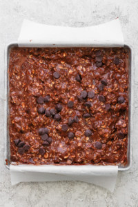 Chocolate oat bars in a baking pan.
