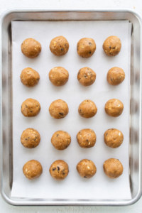 Peanut butter balls on a baking sheet.