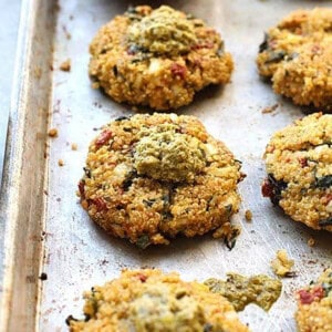 A tray of quinoa patties on a baking sheet.